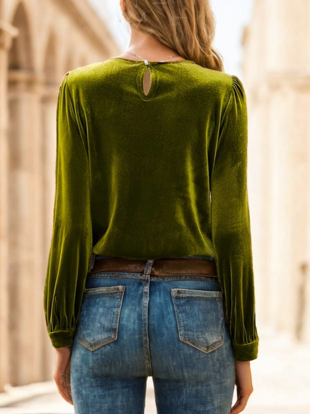Red velvet long sleeve blouse by Alabaster, featuring a chic and elegant design, perfect for dressy occasions.