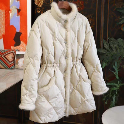 Beige women's quilted winter coat with faux fur trim and cinch waist by Alabaster