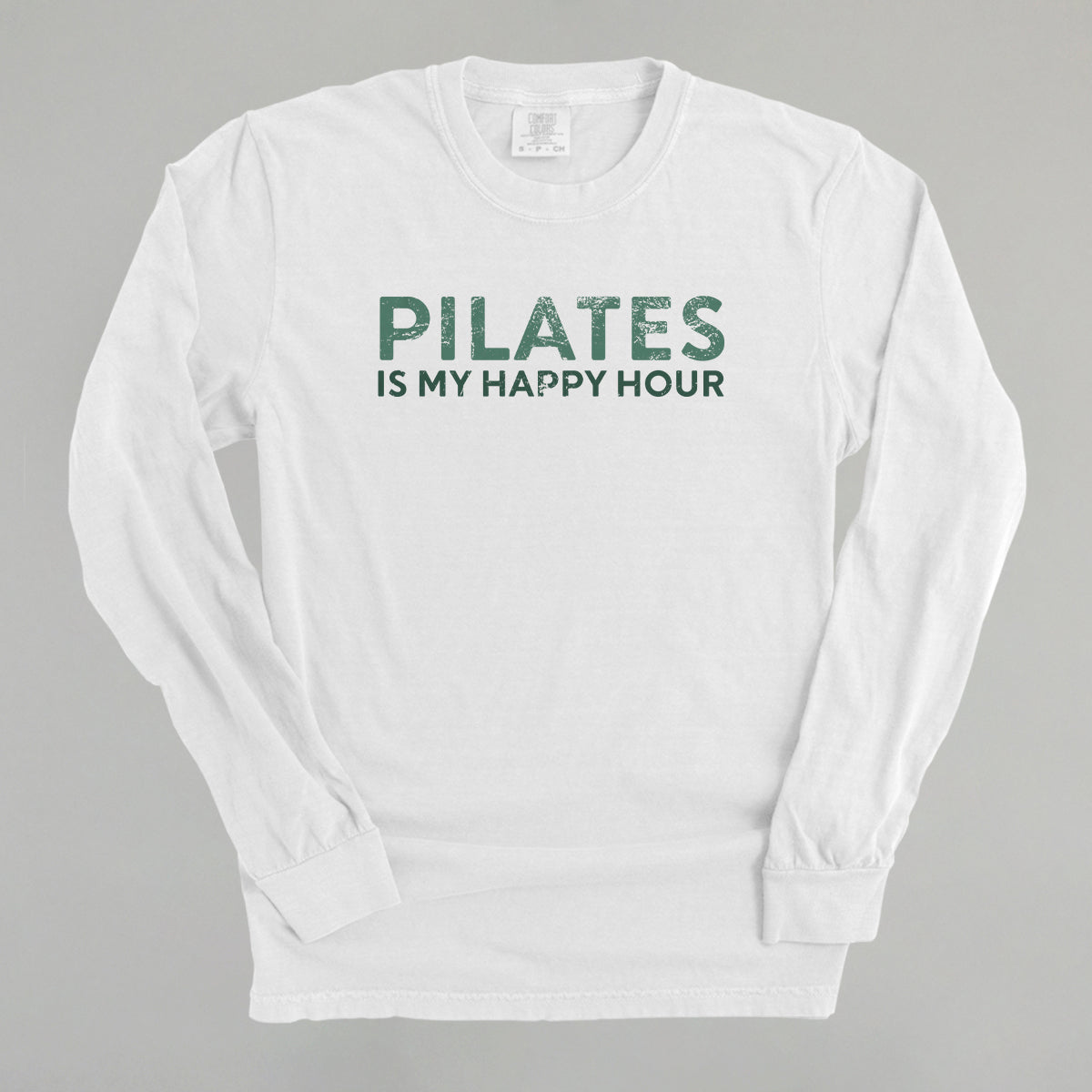 Bay Comfort Colors tee from Ivy + Cloth with 'Pilates Is My Happy Hour' graphic, available in sizes S, M, L.