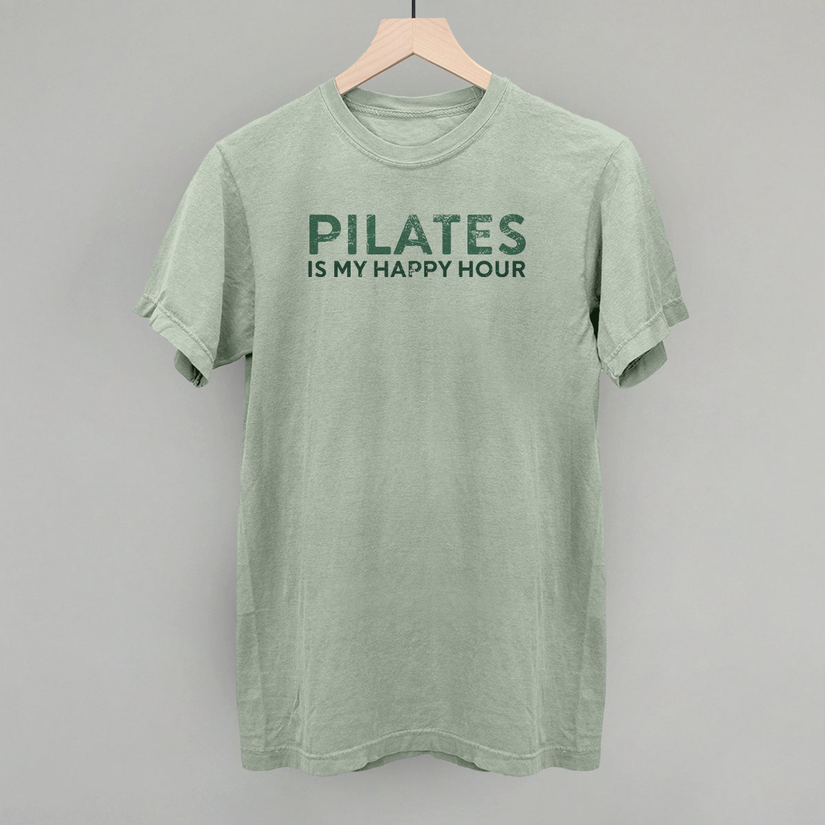 Bay Comfort Colors tee from Ivy + Cloth featuring 'Pilates Is My Happy Hour' graphic, perfect for casual fitness wear.