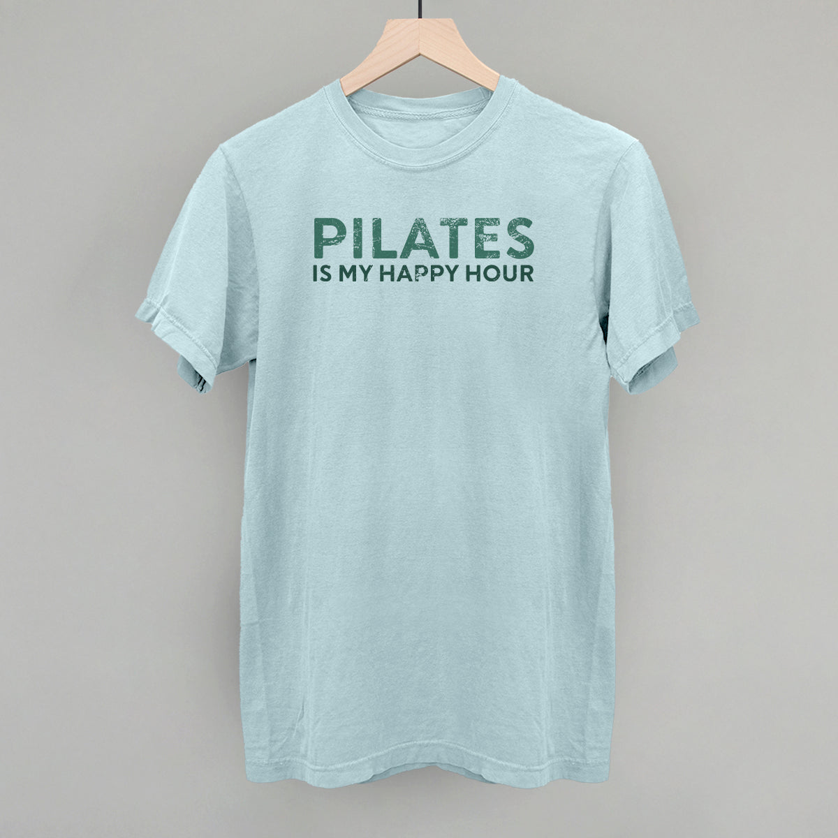 Bay Comfort Colors tee from Ivy + Cloth featuring 'Pilates Is My Happy Hour' graphic, perfect for casual fitness wear.