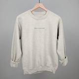 Oatmeal sweatshirt with 'Yoga Is Self Care' text by Ivy + Cloth, available in sizes S, M, and L.