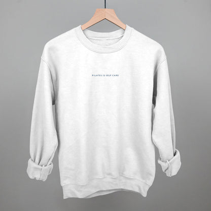 Light blue cotton tee from Ivy + Cloth, part of the Pilates Is Self Care Collection, available in sizes S, M, and L.