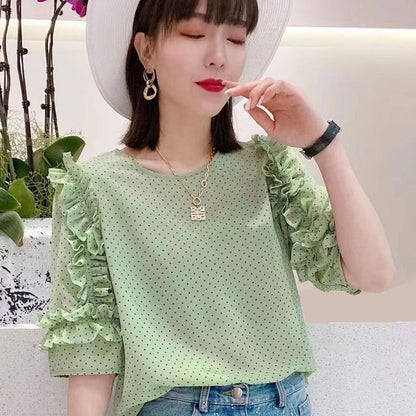 Light blue floral chiffon blouse with ruffle sleeves by Alabaster, featuring a lightweight and breathable design.
