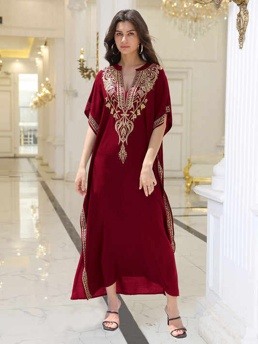Lightweight black embroidered kaftan beach dress with gold thread, boho-style, by Alabaster