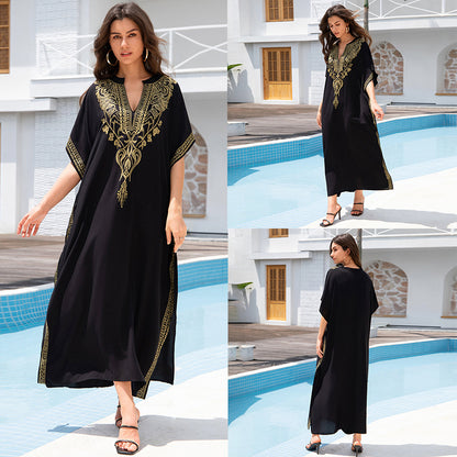 Lightweight black embroidered kaftan beach dress in rayon with gold thread accents by Alabaster