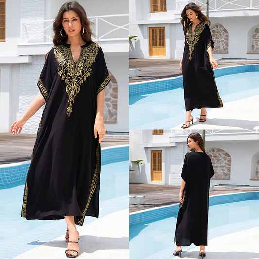 Lightweight black embroidered kaftan beach dress in rayon with gold thread accents by Alabaster