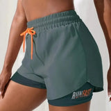 Green women's 2-in-1 RunFast shorts with elastic waistband and orange drawstring from mywellness.health.