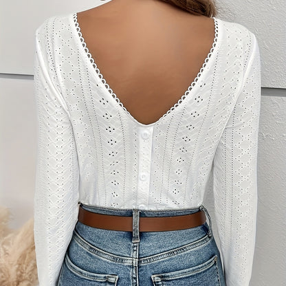 White women's t-shirt with eyelet embroidery and button-back detail by Alabaster