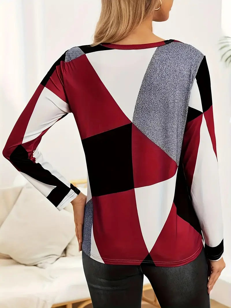Red, white, and charcoal colorblock long sleeve tee by Alabaster in breathable fabric, available in sizes S, M, L.