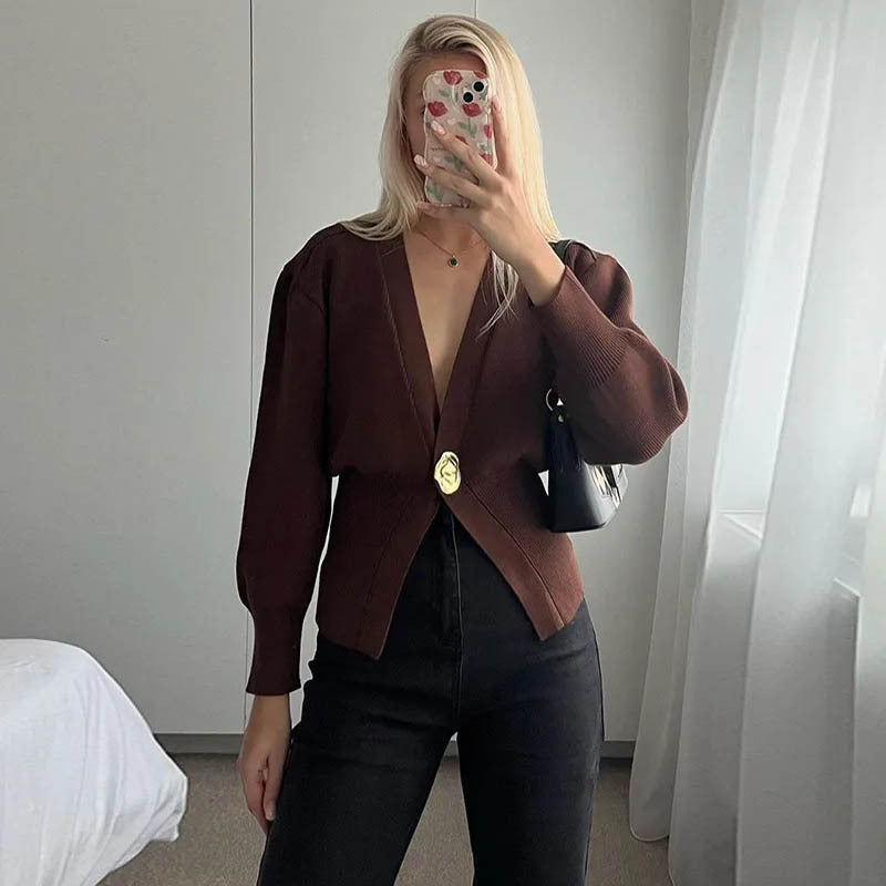 Brown polyester knit deep V button cardigan by Alabaster, featuring a stylish button closure.
