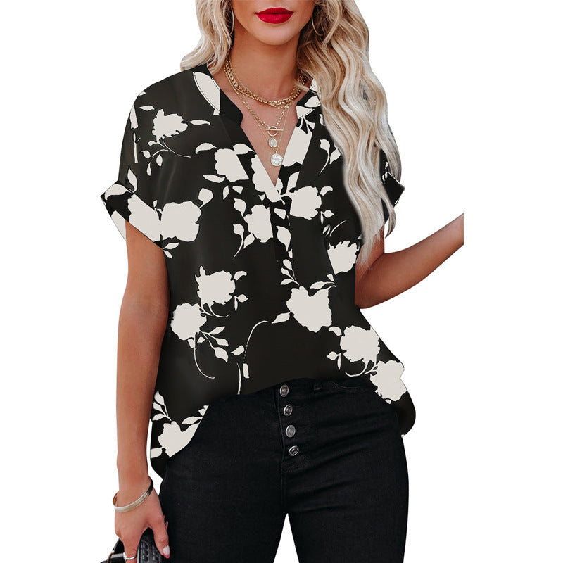 White floral V-neck blouse in lightweight polyester by Alabaster, perfect for summer wear