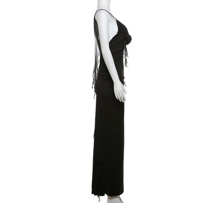 Black elegant suspender dress by Alabaster, curve-hugging design, perfect for cocktail or date night.