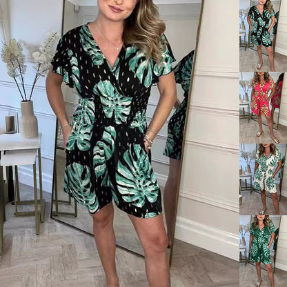 Black lightweight tropical leaf print jumpsuit with V-neck, perfect for summer beach wear by Alabaster.