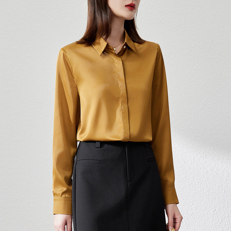 White satin long sleeve blouse with button front, by Alabaster, suitable for office wear.