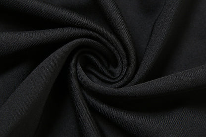 Black elegant suspender dress by Alabaster, curve-hugging design perfect for cocktail parties and date nights.