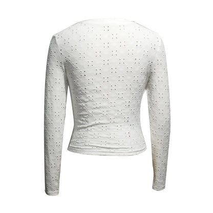 White polyester long sleeve top with eyelet cutouts and V-neck, by Alabaster, featuring an asymmetrical hem.