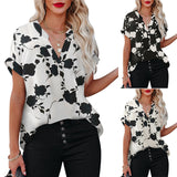 White floral V-neck blouse in lightweight polyester by Alabaster, perfect for summer wear.