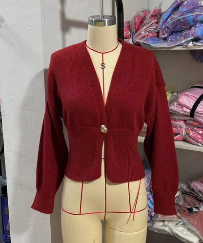 Brown polyester knit deep V button cardigan by Alabaster, featuring a stylish button closure.