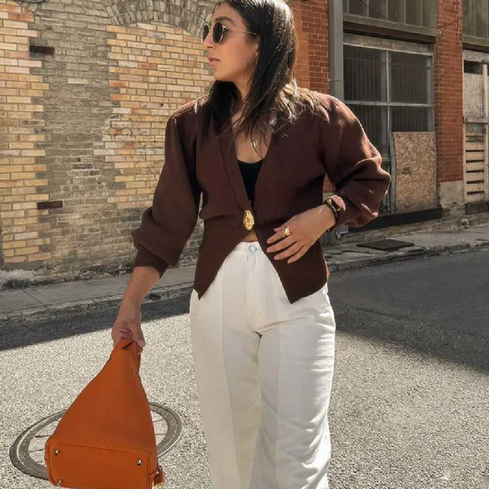 Brown polyester knit deep V button cardigan by Alabaster, featuring a stylish button closure.