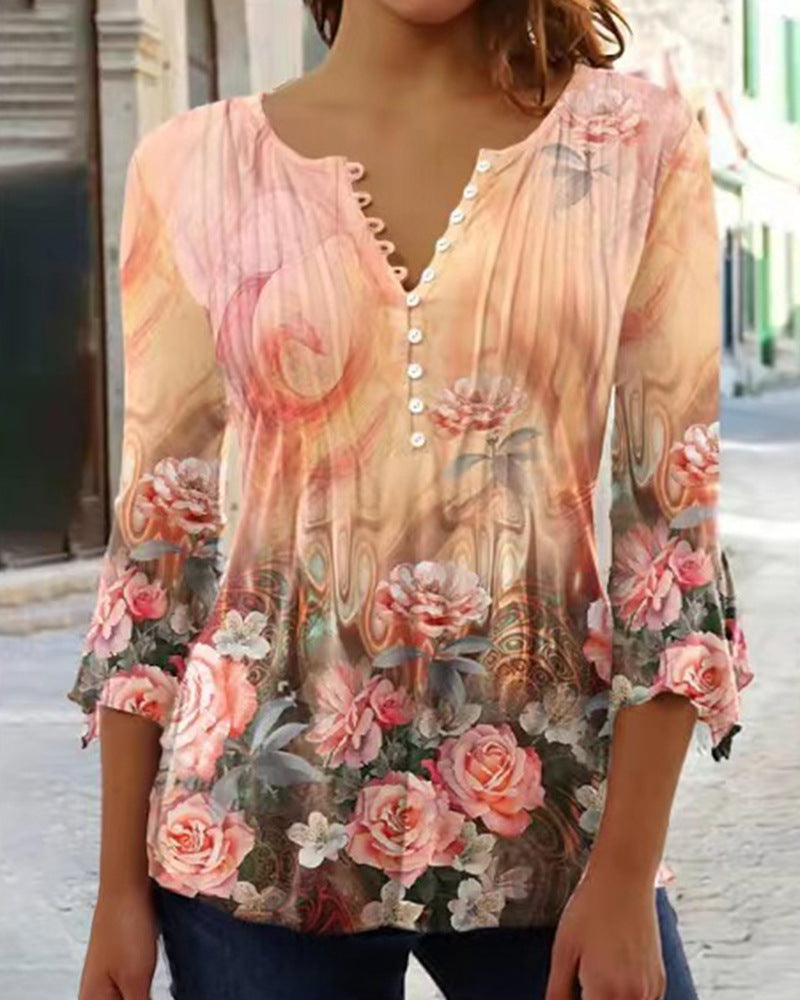 White floral V-neck pleated blouse with 3/4 sleeves and button front by Alabaster